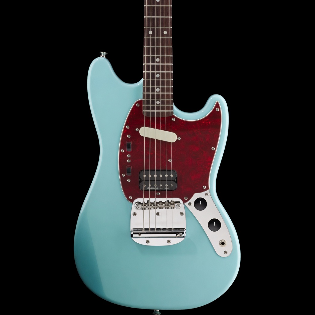 Teal electric guitar on a black background